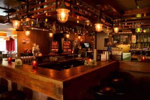 a bar with a wooden counter in a restaurant at Hotel Restaurant de Engel in Lisse