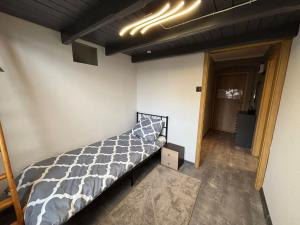 a bedroom with a bed in a room at DWORAK apartment in Przemyśl