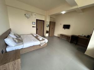 Μια τηλεόραση ή/και κέντρο ψυχαγωγίας στο Sunshine Guest House +12 φωτογραφίες