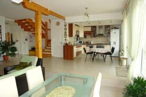 a living room with a couch and a table at Casa Tomson, free parking, ciubăr, piscină în natura in Oradea
