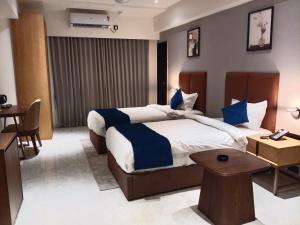 Postel nebo postele na pokoji v ubytování Lords Eco Inn Jamnagar - Maheshwari Nagar + 20 fotografií