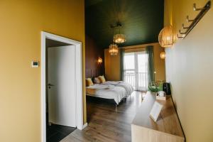 Ένα ή περισσότερα κρεβάτια σε δωμάτιο στο The Hill Guesthouse