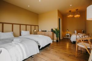 Ένα ή περισσότερα κρεβάτια σε δωμάτιο στο The Hill Guesthouse
