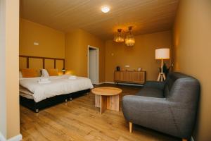 Ένα ή περισσότερα κρεβάτια σε δωμάτιο στο The Hill Guesthouse