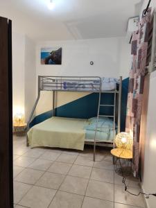 a bedroom with two bunk beds in a room at Les Hauts de Beline Petit-Havre in Le Gosier