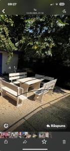 a picture of a picnic table and two benches at Obelisc Costinesti in Costinesti +5 photos