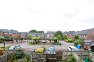 a view of a parking lot in a residential neighbourhood at Stylish 3 or 4 Bed House and Parking in Manchester