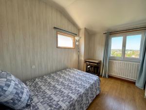 a bedroom with a bed and a window at BORD de MARNE in Champigny-sur-Marne +4 photos
