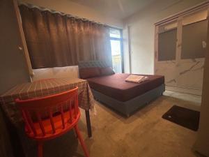 Postel nebo postele na pokoji v ubytování Capricorn hostel Yaowarat