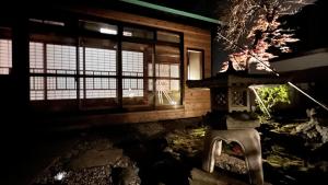 a building with a person in the window of it at Villa Shunten in Wada