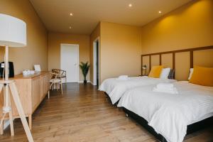 Ένα ή περισσότερα κρεβάτια σε δωμάτιο στο The Hill Guesthouse