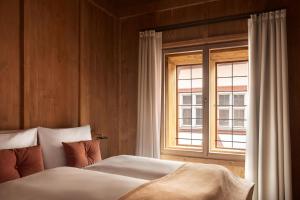 Postel nebo postele na pokoji v ubytování Hotel Krone Oettingen