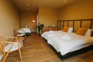 Ένα ή περισσότερα κρεβάτια σε δωμάτιο στο The Hill Guesthouse