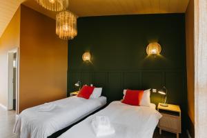 Ένα ή περισσότερα κρεβάτια σε δωμάτιο στο The Hill Guesthouse