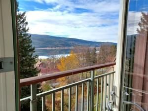 a view of a lake from a balcony at AGO Nya Lundsgården in Åre +7 photos