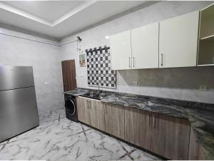 Köök või kööginurk majutusasutuses The Hub Apartment, Lekki