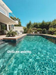 a swimming pool in front of a house at VILLA EVE Bord de plage spa piscine roof top in Andernos-les-Bains