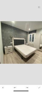 Posteľ alebo postele v izbe v ubytovaní Residencia Compostela