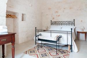Postel nebo postele na pokoji v ubytování Apulian Charme Trulli and Cottage