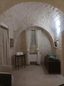 Posezení v ubytování Apulian Charme Trulli and Cottage