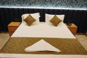 Postel nebo postele na pokoji v ubytování Hotel metroview