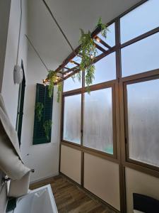 a room with a door and a window at Sofia's Central Apartment Palermo in Palermo