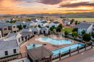 an aerial view of a home with a swimming pool at Desert Haven near Zion with Pool and Hot Tub in Hurricane