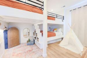 a bedroom with two bunk beds and a mirror at Desert Haven near Zion with Pool and Hot Tub in Hurricane +41 photos