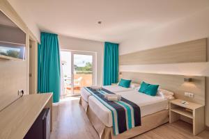Postel nebo postele na pokoji v ubytování Welikehotel Fenix