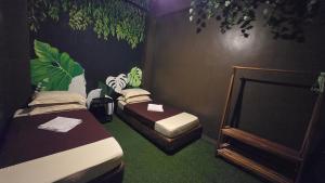 Ένα ή περισσότερα κρεβάτια σε δωμάτιο στο Kingslanding Hostel PPC +5 φωτογραφίες