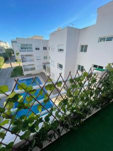 a view of a building and a swimming pool at Salam Beach in Pont Blondin