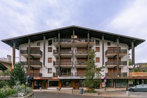 a building with balconies on the side of it at Arly in Megève