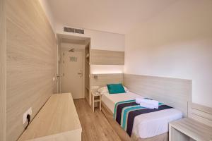 Postel nebo postele na pokoji v ubytování Welikehotel Fenix