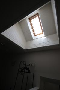 a skylight in a room with a ceiling at Stag View, River Black Water Holiday Flats, INCHBAE, GARVE, IV232PG in Garve
