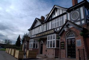 a building with a sign on the front of it at George & Dragon in Coleshill