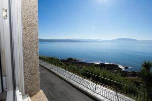 a view of the ocean from a building at Casa Marzoa in Finisterre +3 photos