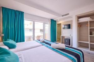 Postel nebo postele na pokoji v ubytování Welikehotel Fenix