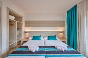 Postel nebo postele na pokoji v ubytování Welikehotel Fenix