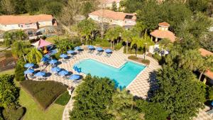 an overhead view of a swimming pool at a resort at Spectacular House with 3 BR - Private Pool, BBQ - Minutes from Disney! in Kissimmee