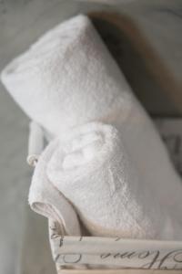 a close up of a white tie with a note at Villa Happening in Imerovigli