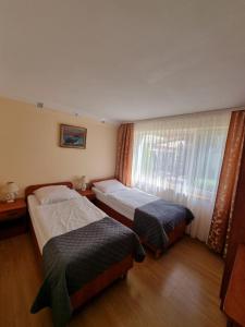 Posteľ alebo postele v izbe v ubytovaní Gościniec pod Polną Różą 2