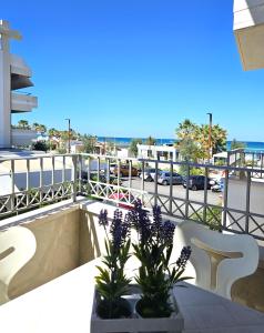 a balcony with a view of a parking lot at I SUONI DEL MARE in Porto San Giorgio