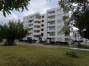 an apartment building with a park in front of it at Alojamiento Parque Libertad in La Serena
