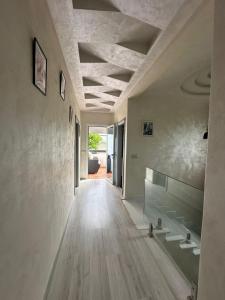 a hallway of a house with wooden floors and ceilings at villa Alcudia SMIR 3 chambre fnedeq restinga tetoin in Fnidek