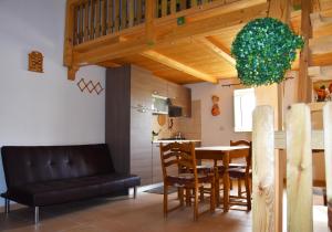 a kitchen and dining room with a table and chairs at Giardino del Gelso in Marconia