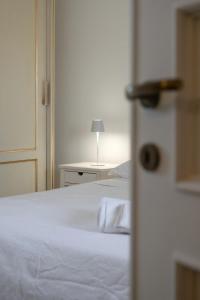 A bed or beds in a room at Masseria Galatea Agriturismo