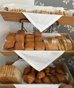 a display of different types of bread and pastries at Aliston Hotel Thassos in Skala Potamias