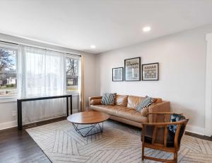 a living room with a couch and a table at Franklin Retreat - Sleeps 4 in Franklin