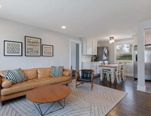 a living room with a couch and a table at Franklin Retreat - Sleeps 4 in Franklin