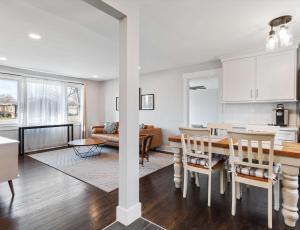 a kitchen and living room with a table and chairs at Franklin Retreat - Sleeps 4 in Franklin